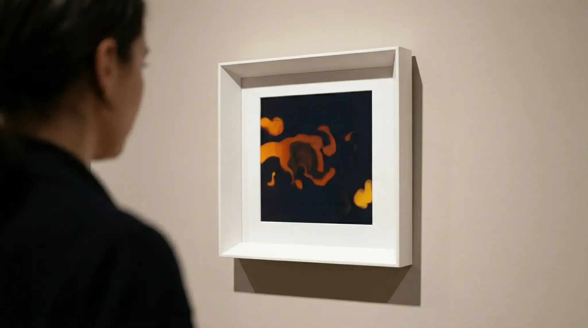 AELIG frame hanged on a wall and a person watching