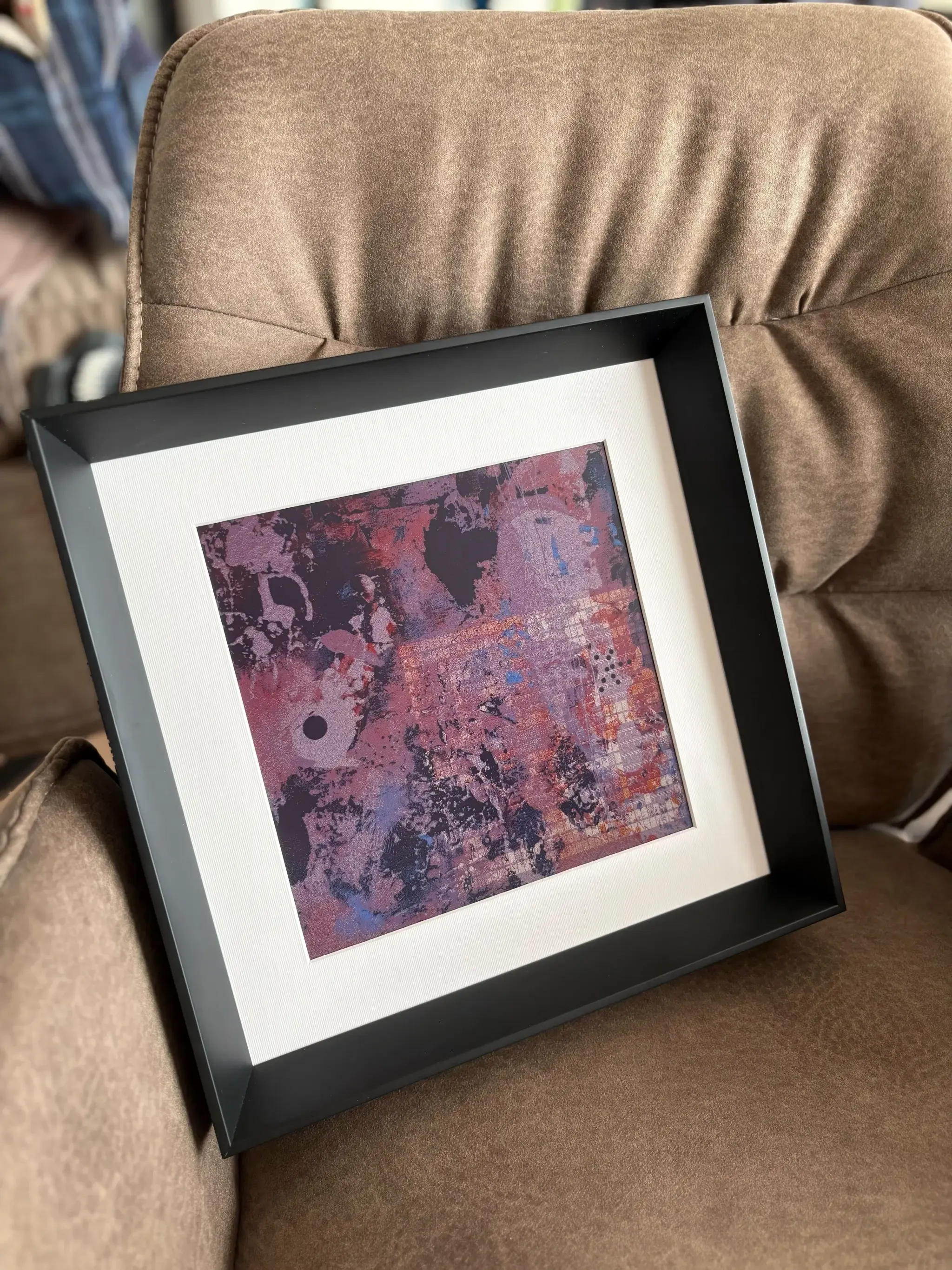AELIG frame placed over a couch